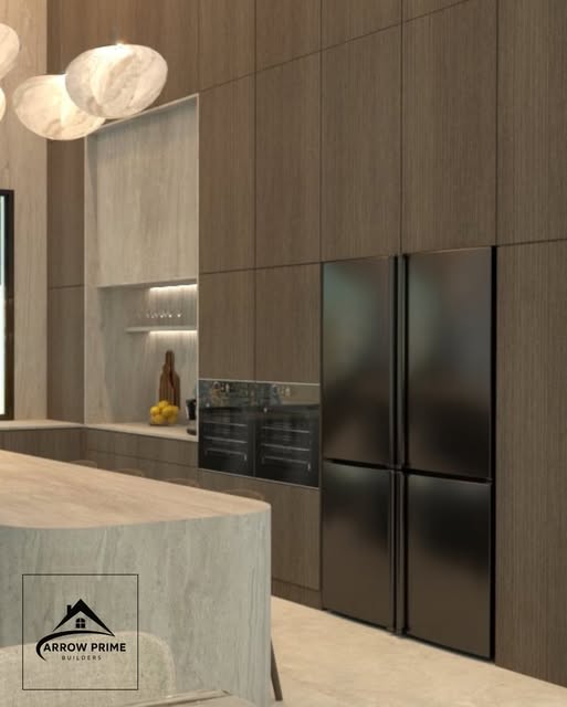 Kitchen design with wood cabinetry and black built-in refrigerator