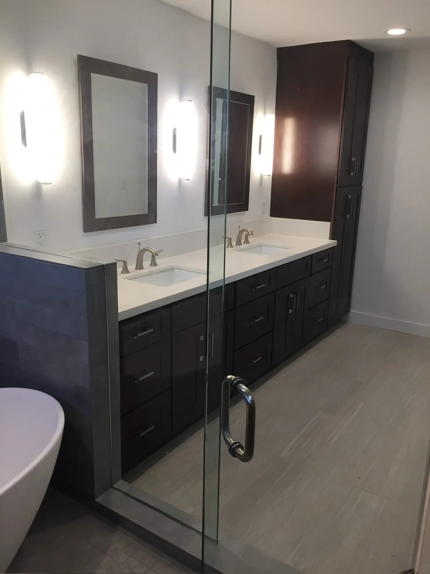 Primary bath double vanity with linen tower and quartz top