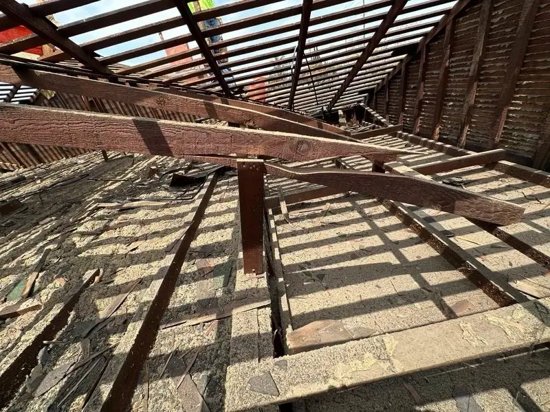Roof framing exposed during a full tear-off