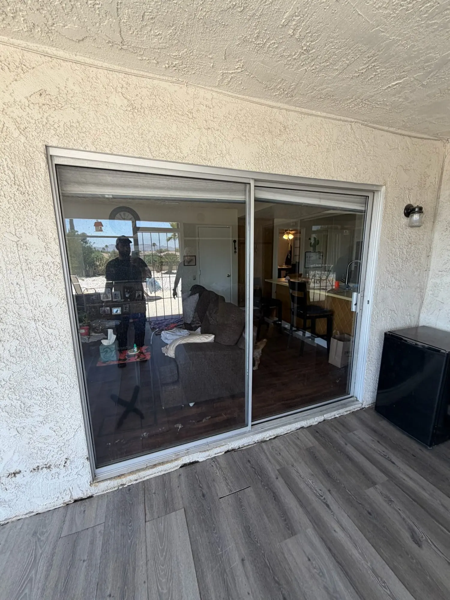 Old aluminum sliding door before replacement